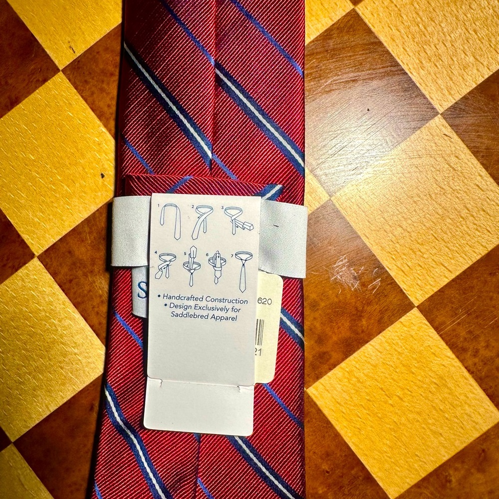 NWTO Saddlebred tie featuring a classic red and blue striped pattern.